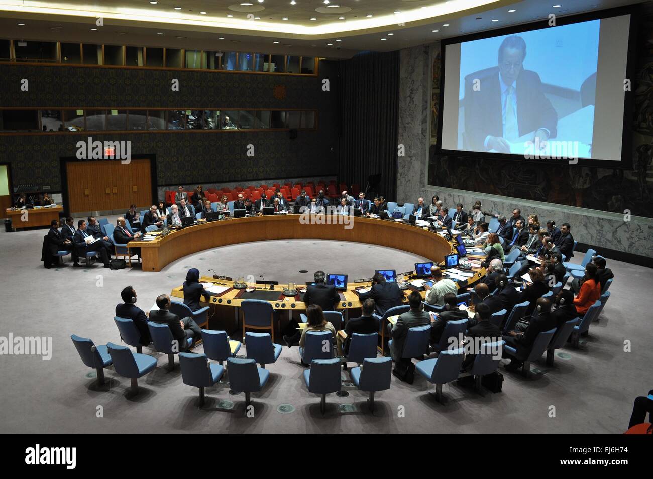 New York, UN headquarters in New York. 22nd Mar, 2015. The UN Security Council hears a briefing by UN Special Adviser JamaL Benomar via video link from Doha, during the council's emergency meeting on the situation of Yemen, at the UN headquarters in New York, on March 22, 2015. The UN Security Council on Sunday adopted a presidential statement on Yemen, voicing support for Yemeni President Abdo Rabbo Mansour Hadi and calling upon all parties to refrain from taking actions that undermine the legitimacy of the president. © Niu Xiaolei/Xinhua/Alamy Live News Stock Photo