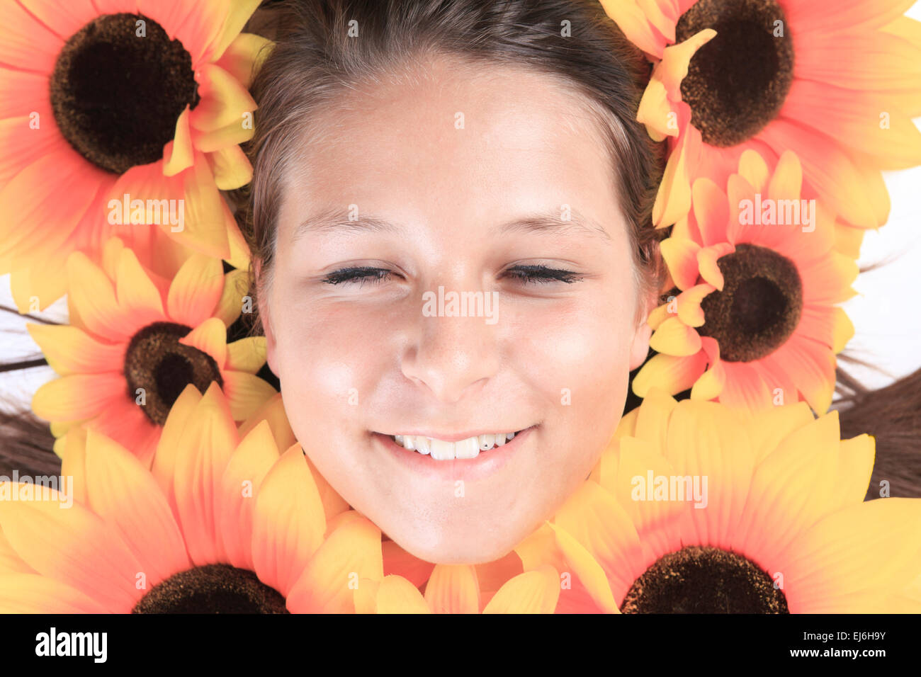 Portrait of a young woman with sunflowers Stock Photo - Alamy