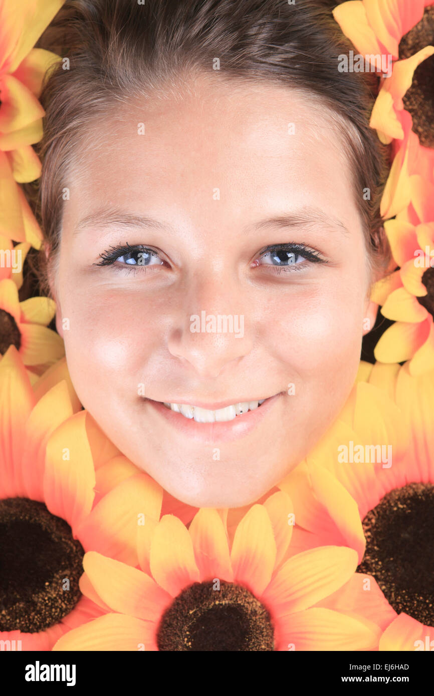 Portrait of a young woman with sunflowers Stock Photo - Alamy