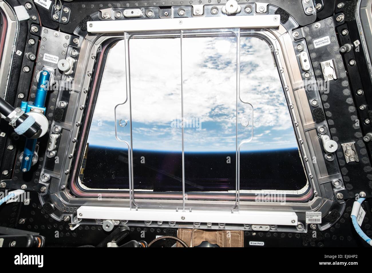 View from the International Space Station Cupola window of the Earth February 8, 2015 in Earth orbit.  The Cupola, a small, dome-shaped module has seven windows -- six around the sides and one on top -- that can be shuttered when not in use to protect the ISS from micrometeoroids and the harsh space environment. The windows are made of fused silica and borosilicate glass panes, with temperature-sensing elements and window heaters. It is attached to the Tranquility Node 3 module, Cupola provides a vastly improved view of the station's exterior. Stock Photo