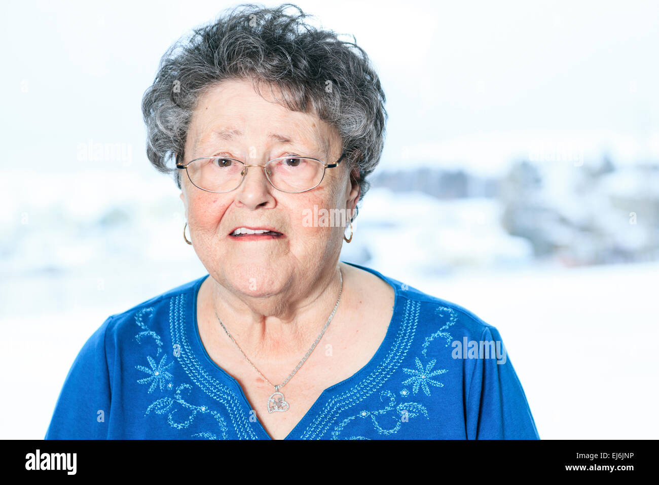 A portrait of a 90 years old senior in is apartment Stock Photo