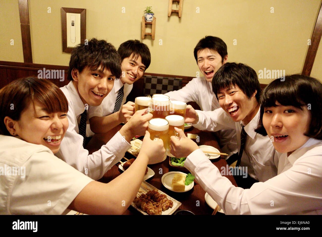 Japanese business people drinking at a Japanese style Izakaya Stock