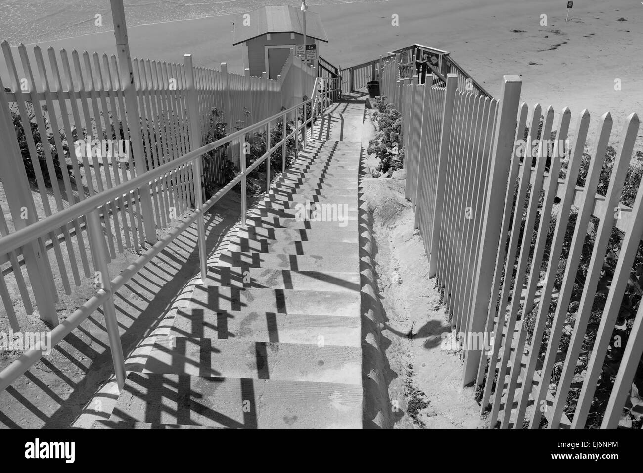 Beach access in Solana Beach, CA with concrete stairs to the sand Stock