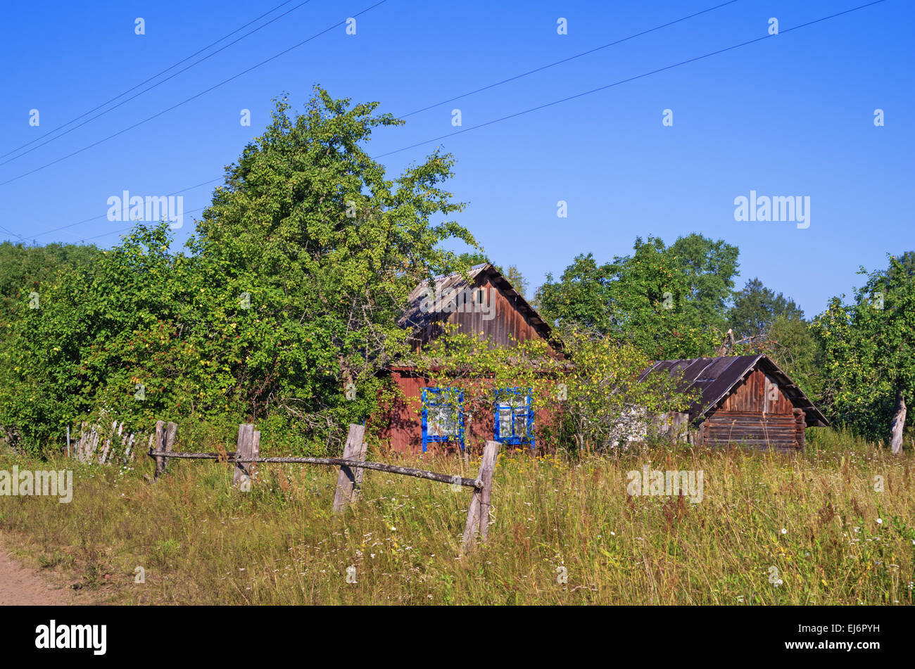 Rural landscape - wooden house and old fence Stock Photo - Alamy