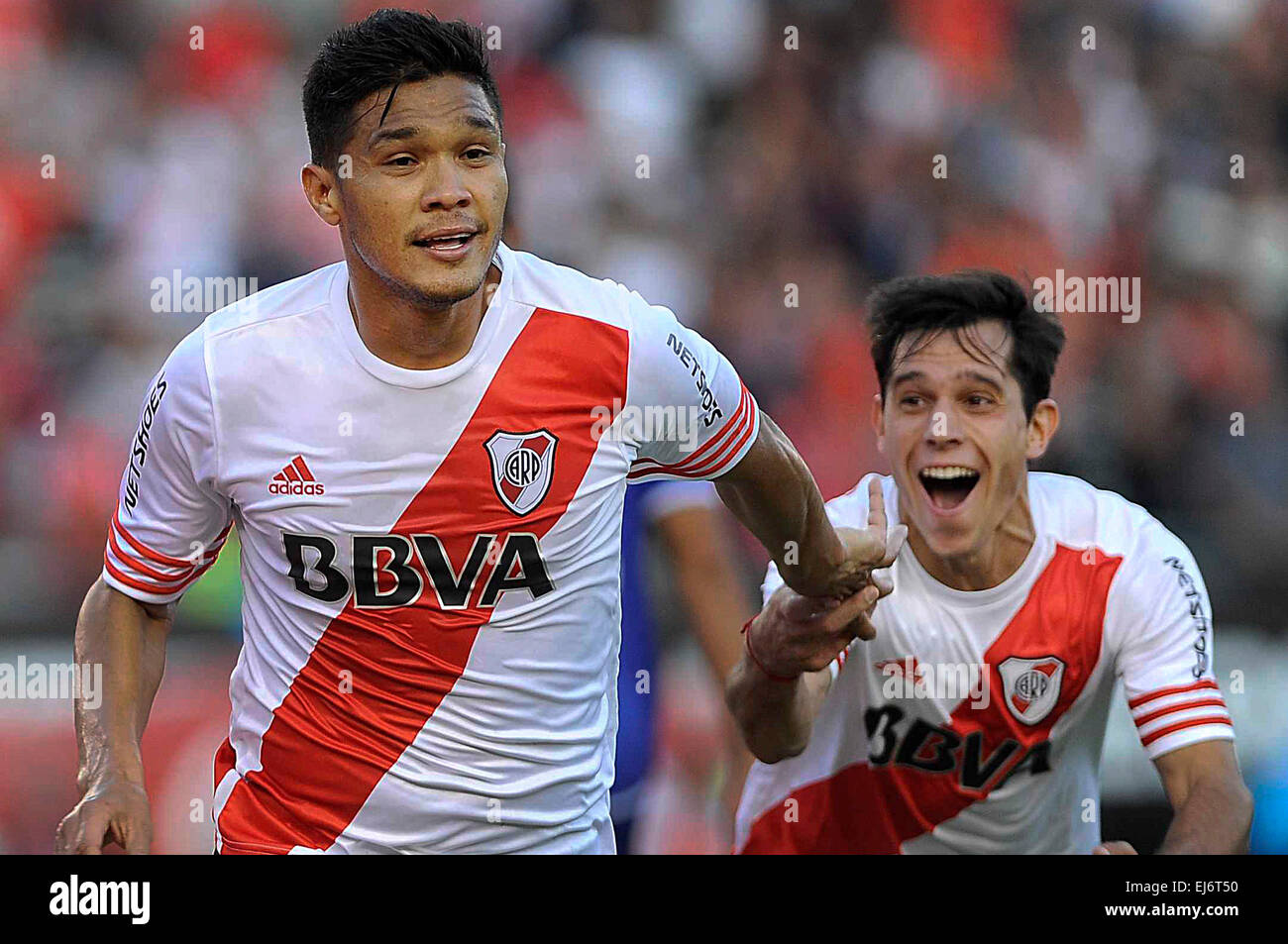 Buenos Aires, Argentina. 22nd Mar, 2015. River Plate's Teofilo Gutierrez (L) celebrates a score during the match corresponding to the first division championship of the Argentine soccer against Godoy Cruz, in the Monumental Stadium, in Buenos Aires, Argentina, on March 22, 2015. River Plate won the match. © Osvaldo Fanton/TELAM/Xinhua/Alamy Live News Stock Photo