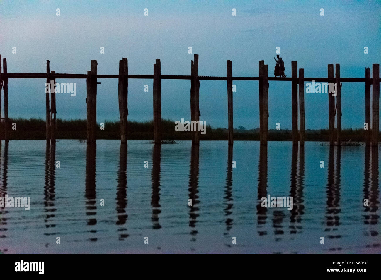 Amarapura’s famous U Bein teak bridge on Taungthaman Lake at dawn ...