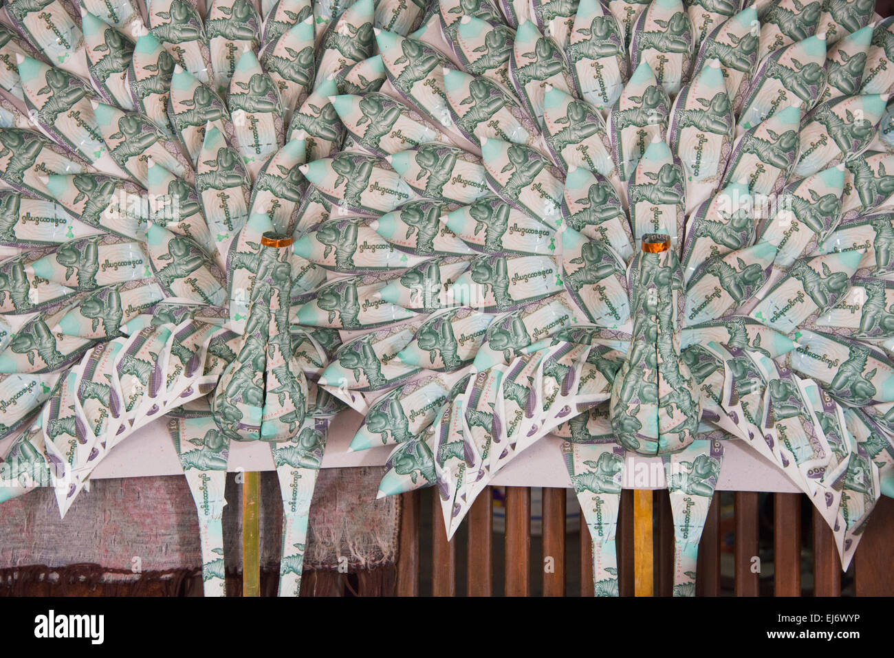 Paper money made crane donation to temple, Mandalay, Myanmar Stock Photo