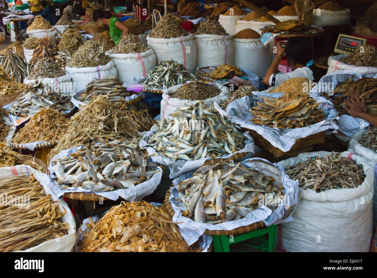 Selling dried fish at the market, Mandalay, Myanmar Stock Photo