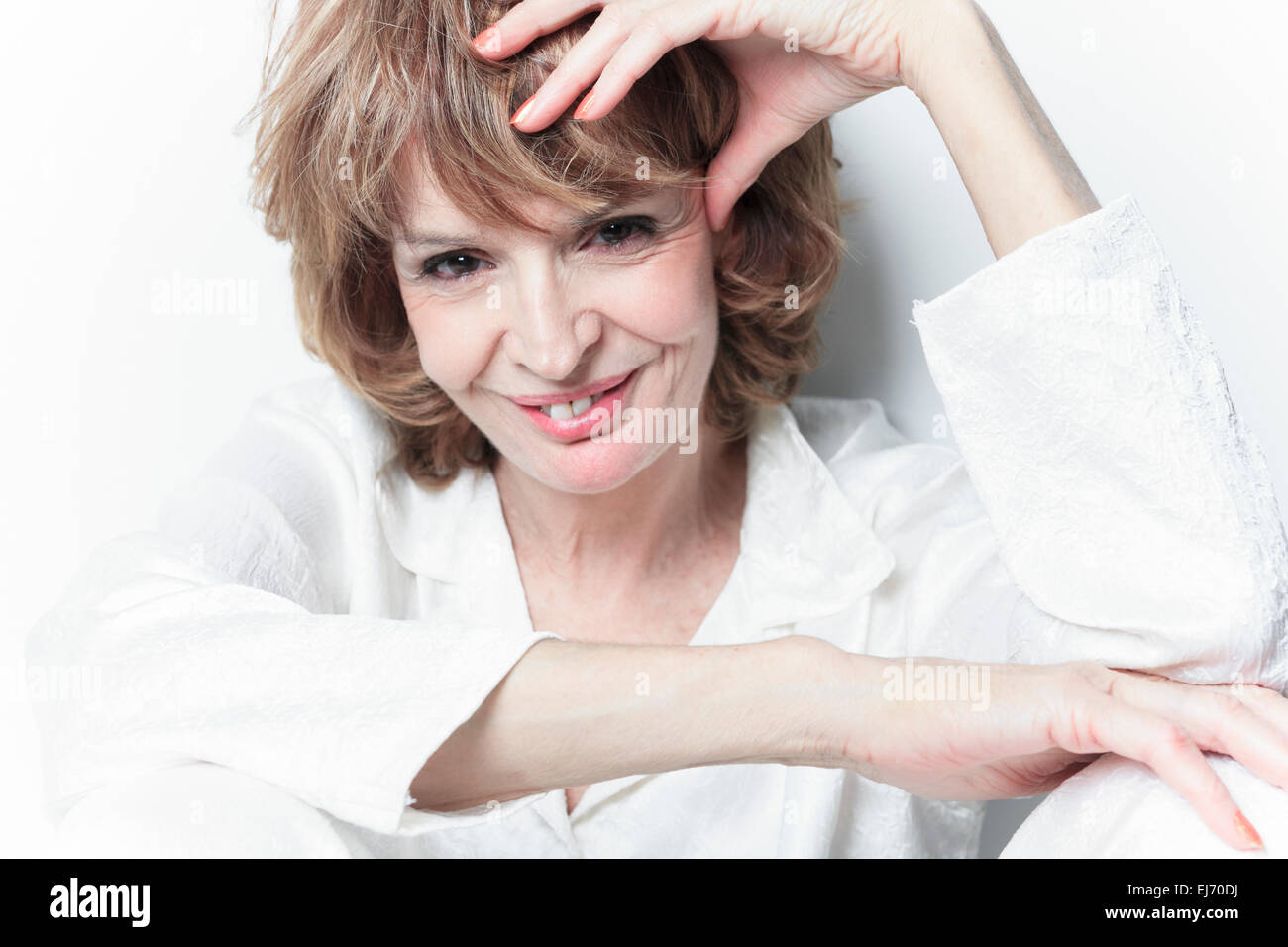 A senior woman in front of white background Stock Photo - Alamy