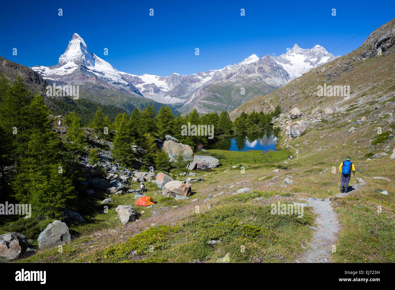 Hiker And A Wild Camper At Grindjisee Lake The Matterhorn At The Stock Photo Alamy