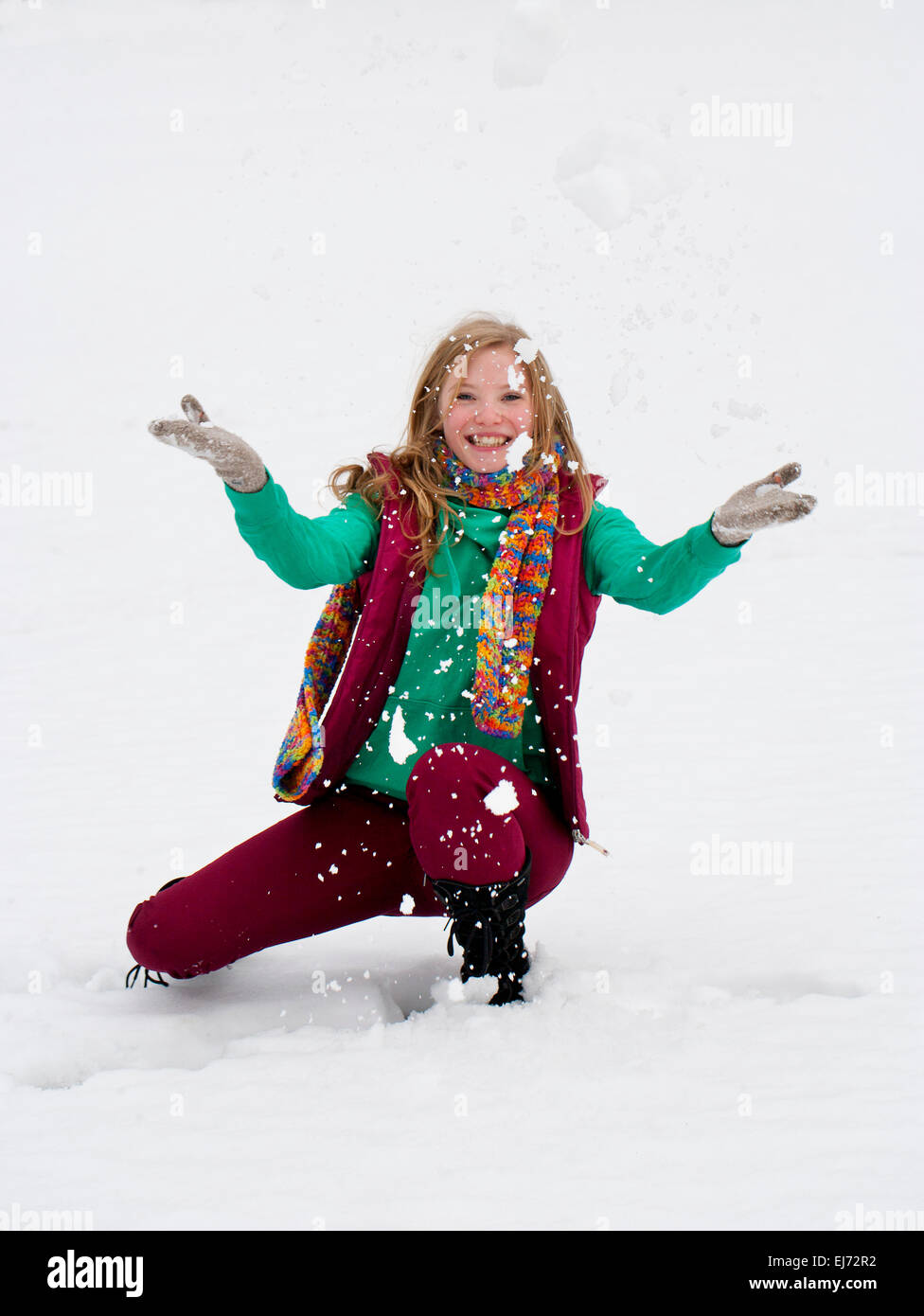 Young woman, 20 years, in winter clothes in snow Stock Photo