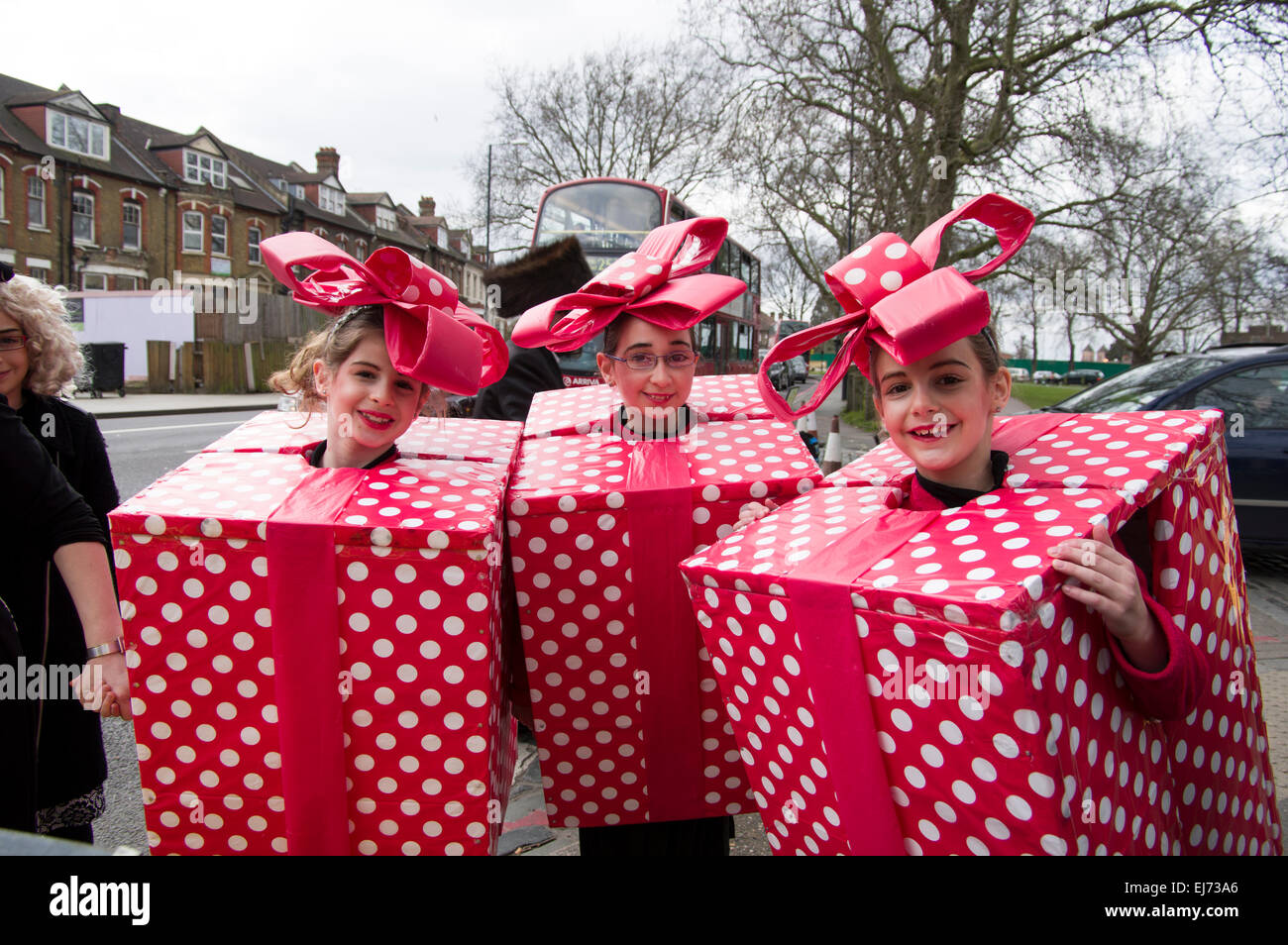 Three girls in homemade fancy dress costumes for the Jewish holiday of Purim in Stamford Hill, London 5 March 2015. Stock Photo