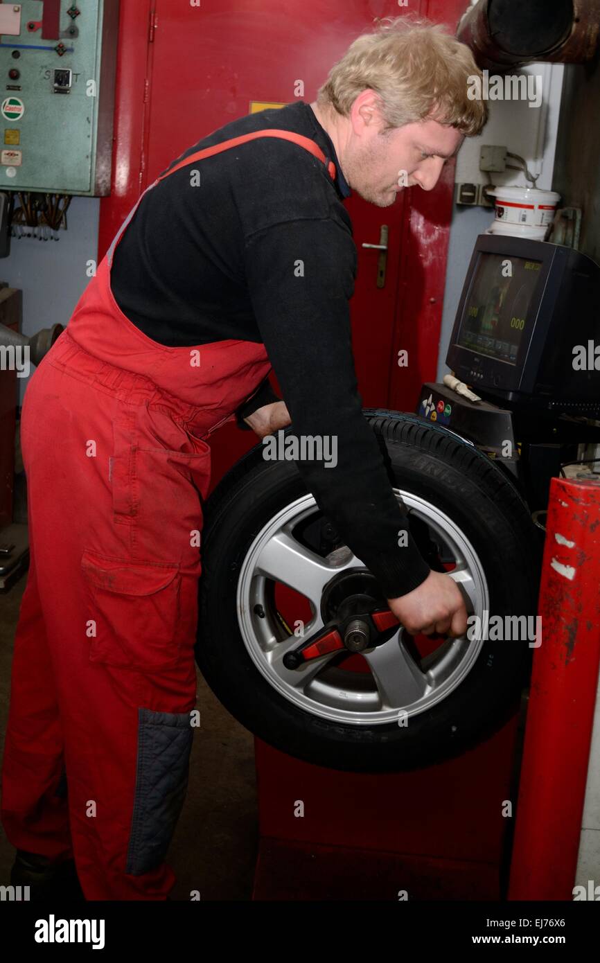 Mechanic balanced tires Stock Photo