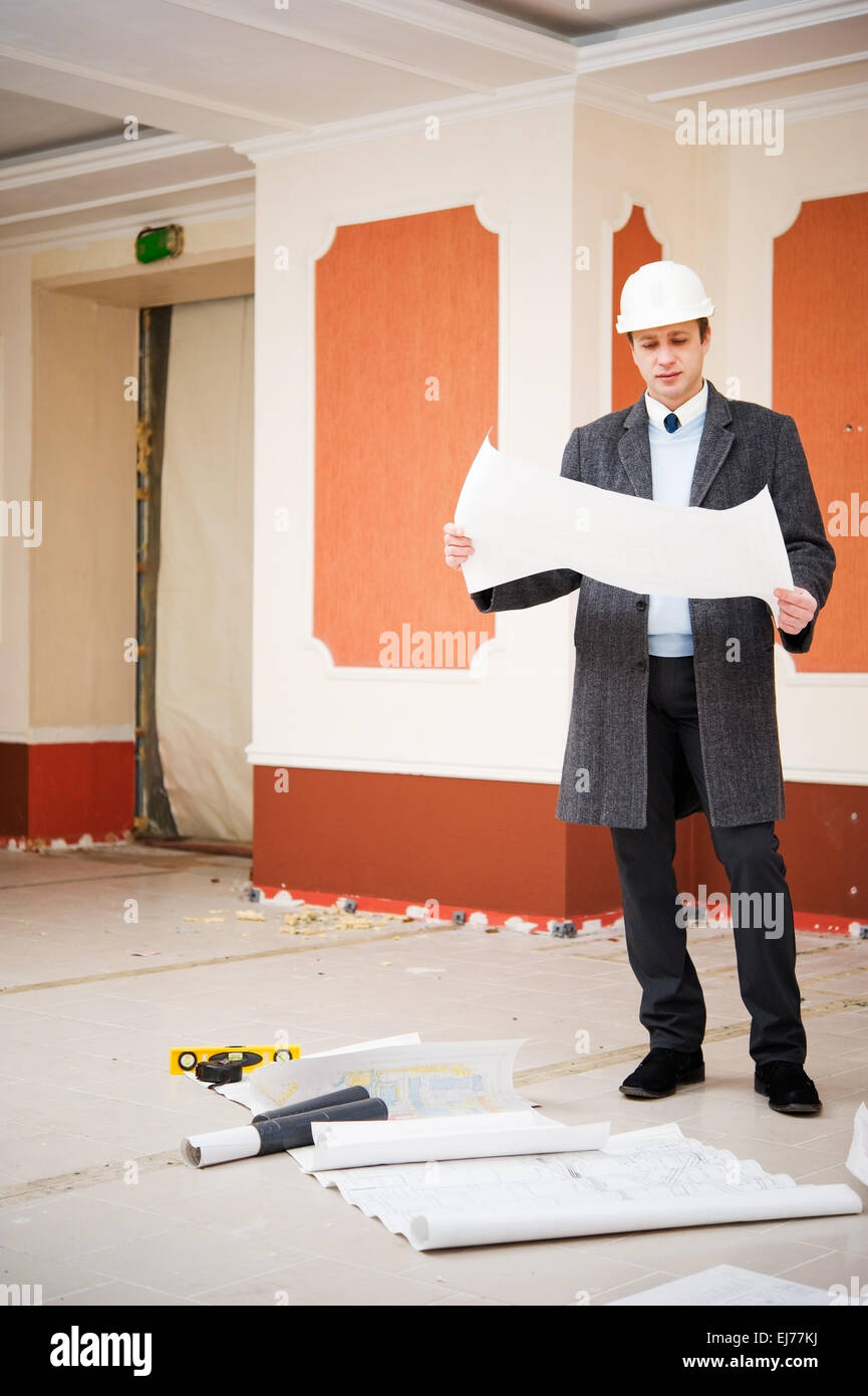 Engineer with plans Stock Photo - Alamy