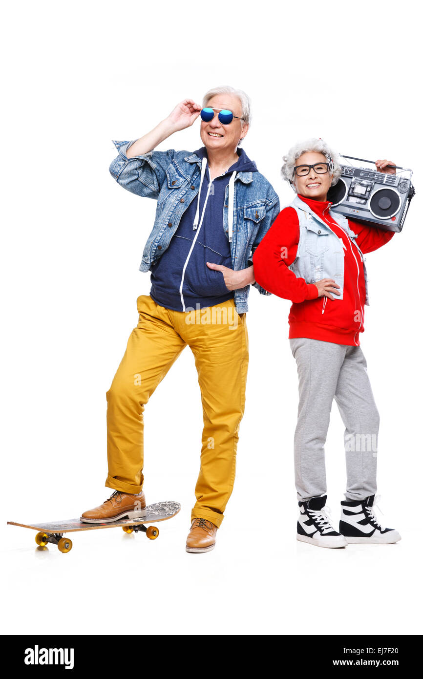 The old couple fashion with a skateboard and recorder Stock Photo - Alamy