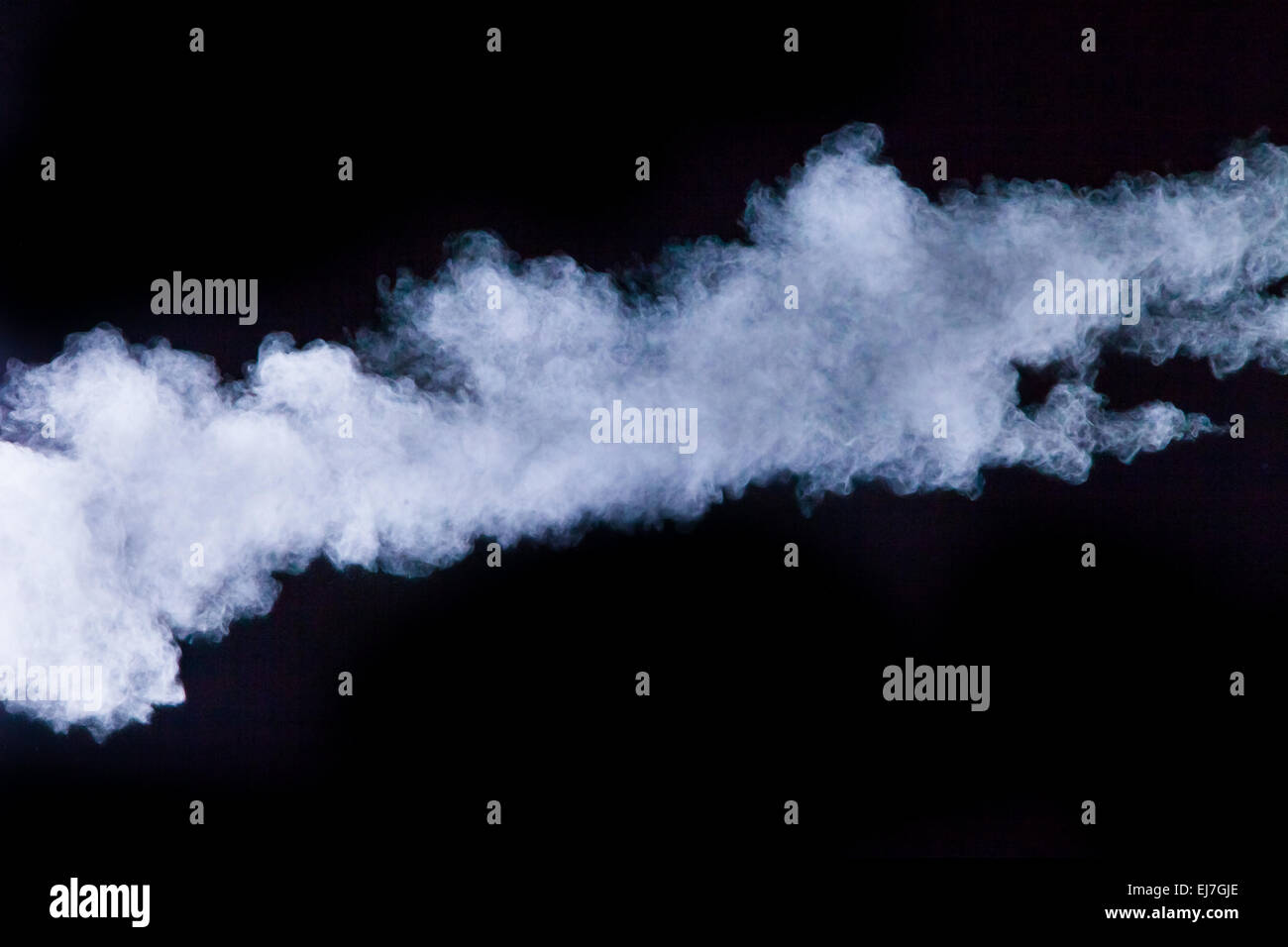Launched colorful powder, isolated on black background Stock Photo - Alamy
