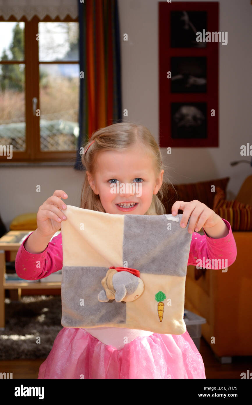 Child as a princess with soft toy Stock Photo