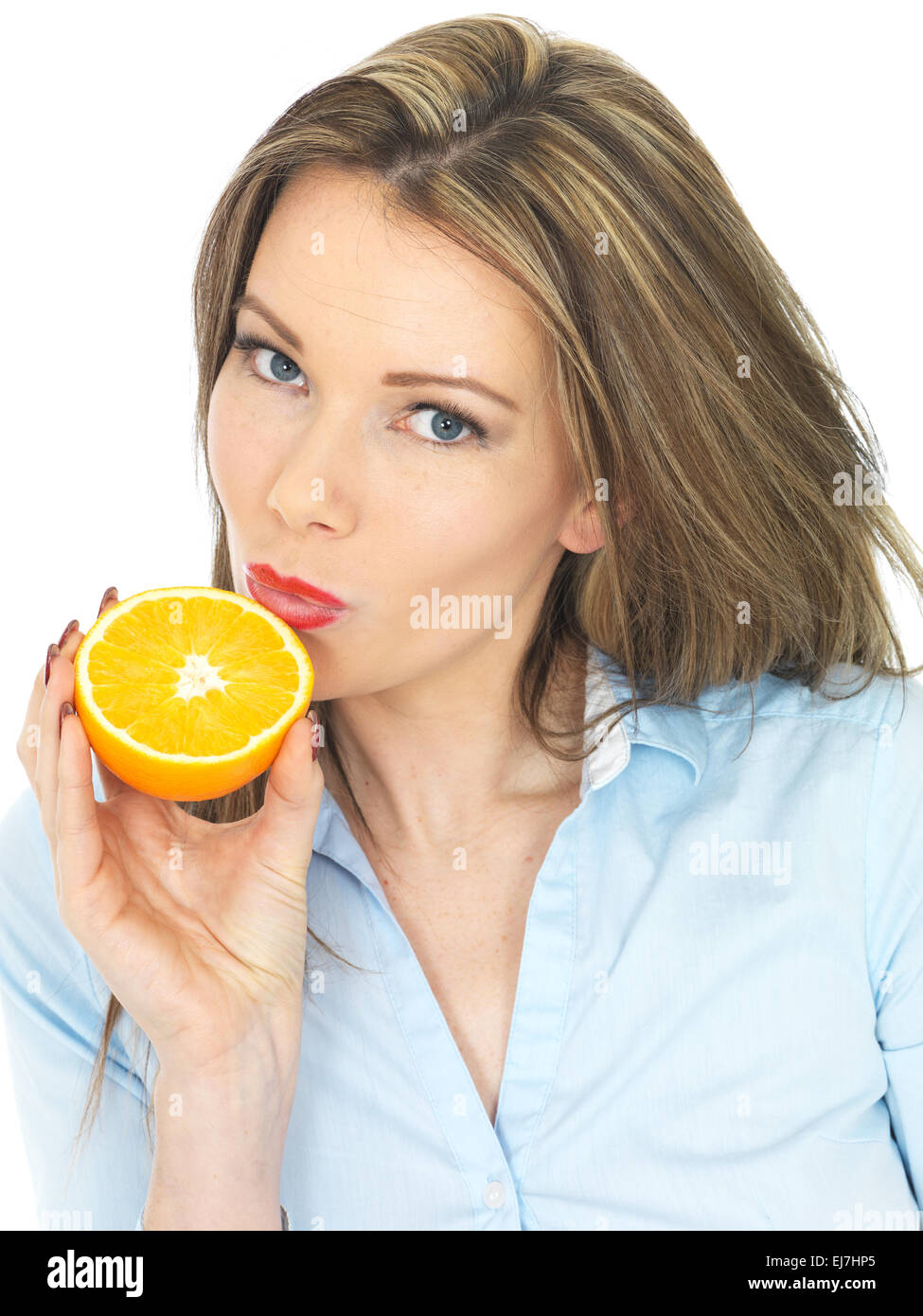 Attractive Young Woman Holding an Orange Stock Photo - Alamy