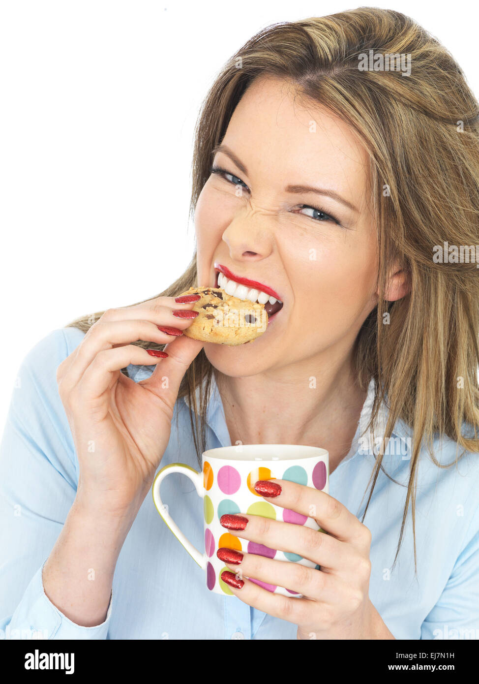 Attractive Young Woman Enjoying Tea and Biscuits Stock Photo Alamy