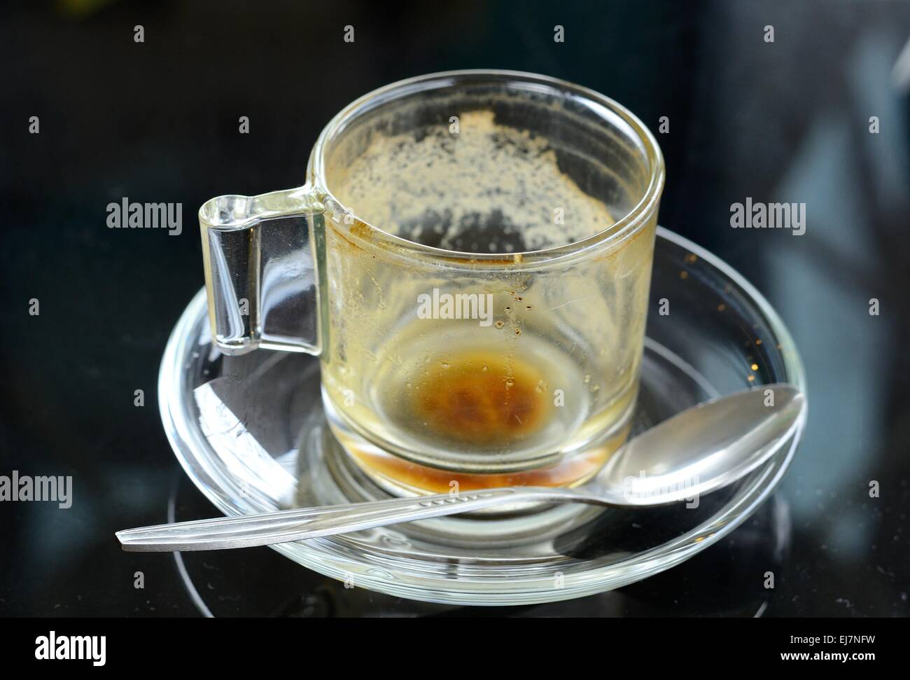 empty cup of Thai style hot  coffee on the old  table Stock Photo