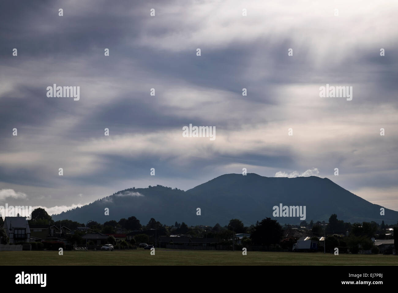 Early morning view of mount Tauhara with light through soft cloud cover, Taupo, New Zealand. Stock Photo