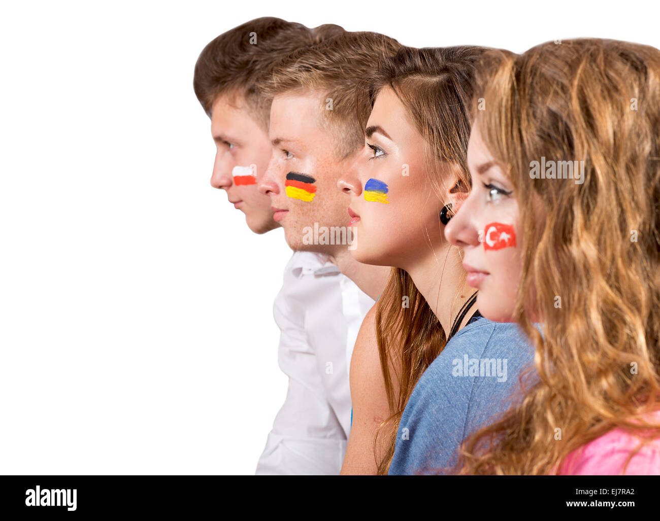 Four teenagers with flags drawn on the faces Soccer fans with different country flags painted on faces Stock Photo