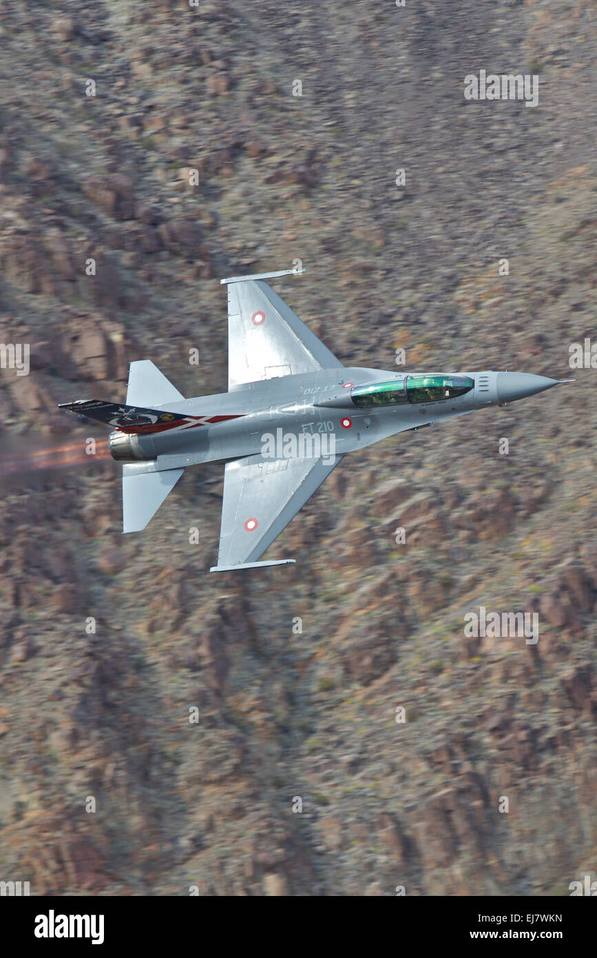 Close Up Photo Of A Royal Danish Air Force (Flyvevåbnet) F-16 Jet Fighter, Reheat  Alight, Flying Along Rainbow Canyon. Stock Photo