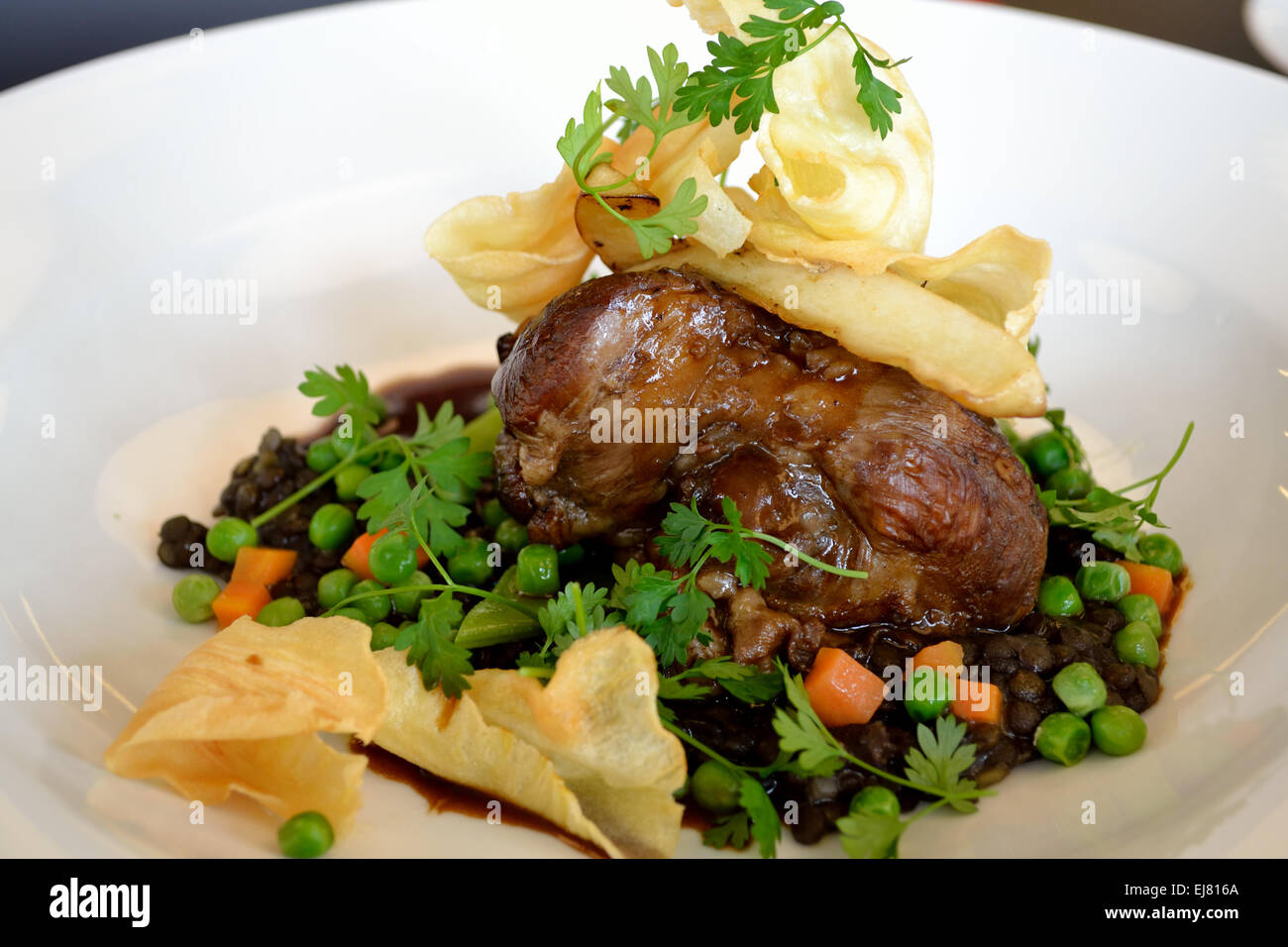 Knuckle of lamb with vegetables Stock Photo