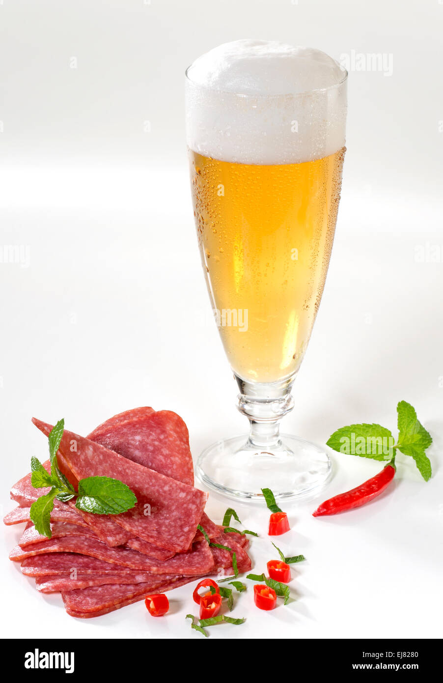 Glass of beer and salami Stock Photo Alamy