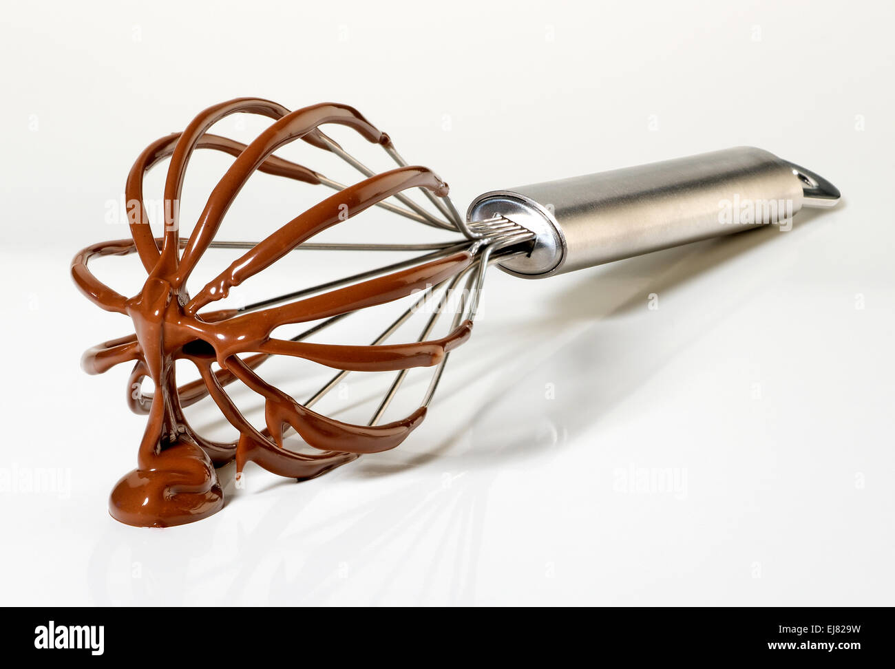 Wire whisk with chocolate(+clipping path) Stock Photo