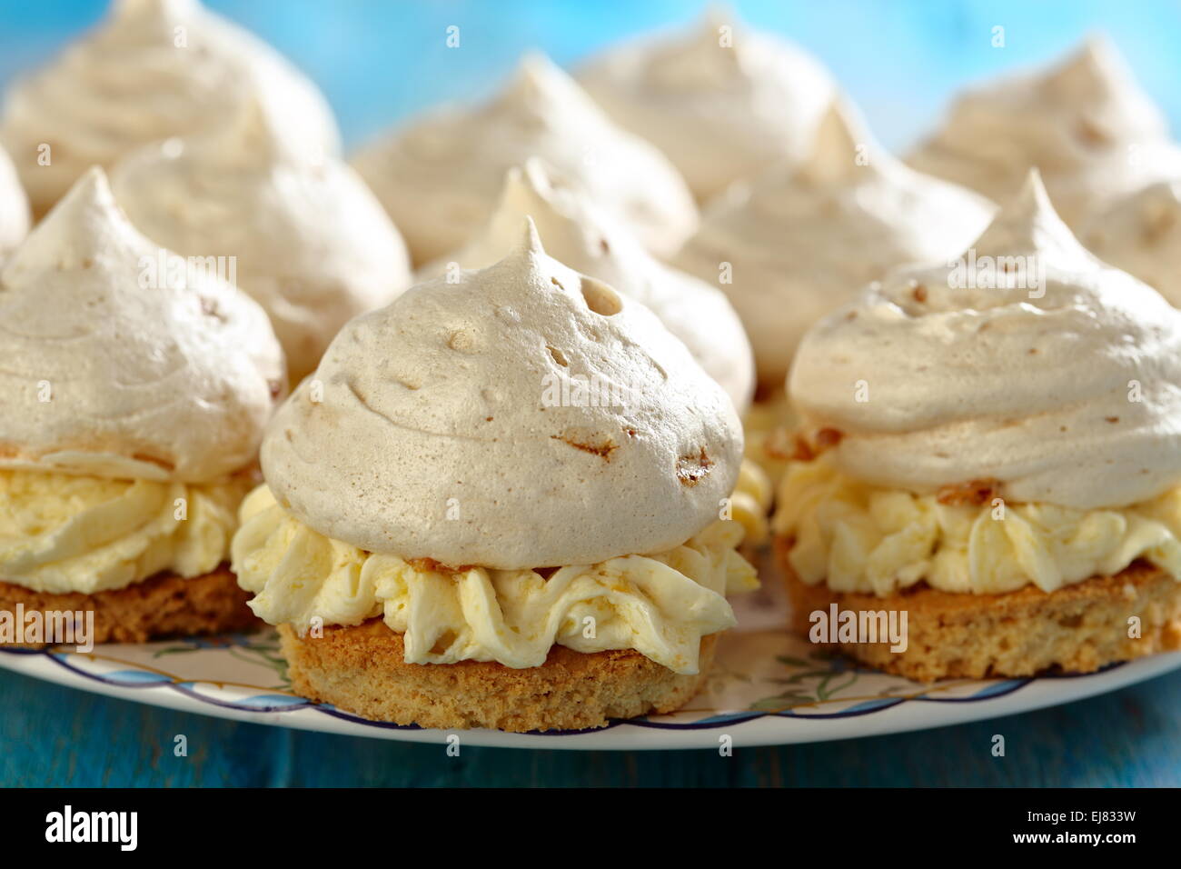 Meringue cakes with cream. Stock Photo