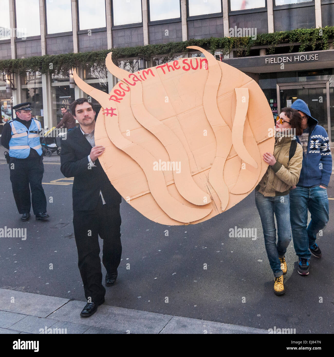 London Bridge Station, London, UK.  23rd March, 2015. Demonstrators gather with their placards outside News UK's headquarters, 'the Little Shard' near London Bridge as part of the Occupy Rupert Murdoch protest.  The protest is against the dominance of billionaire owners of UK media: Rupert Murdoch (News UK), Viscount Rothermere (Daily Mail Group), Richard Desmond (The Express) and the Barclay brothers (Telegraph). Credit:  Stephen Chung/Alamy Live News Stock Photo