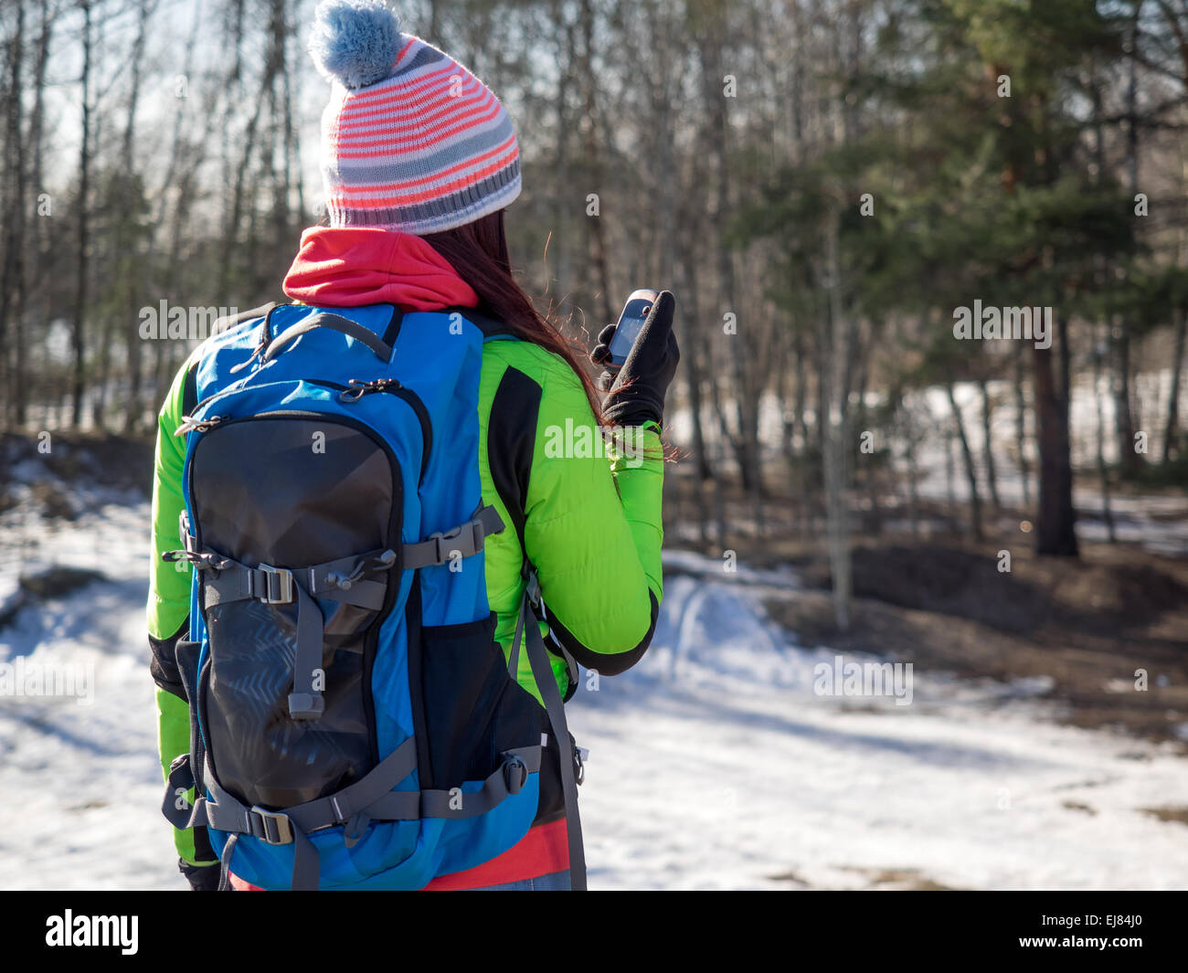 Hiker tracks his position at the gps Stock Photo Alamy