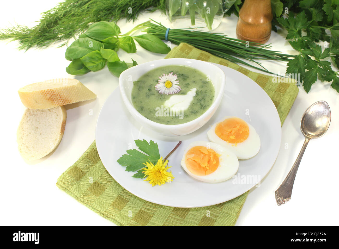 herbs soup with a dollop of cream Stock Photo