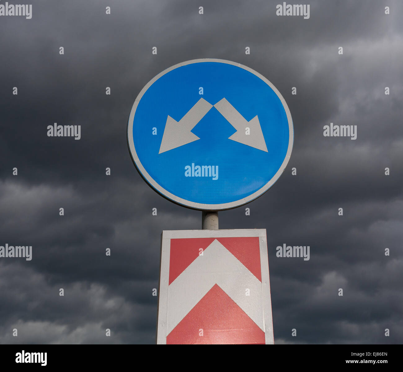 Road sign against cloudy sky Stock Photo - Alamy