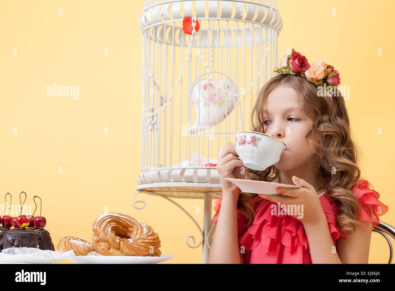 Portrait of elegant little lady drinking tea Stock Photo - Alamy