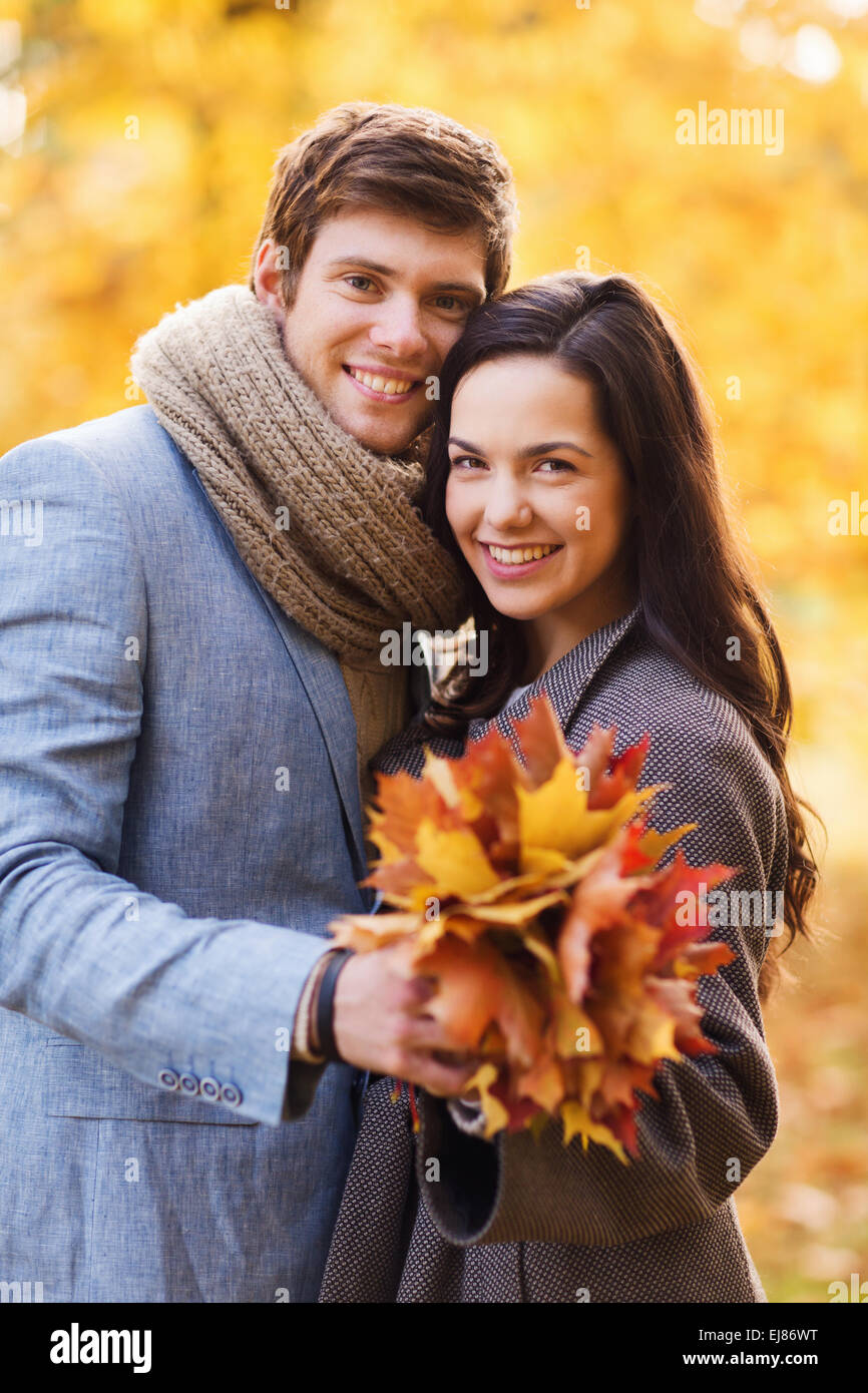 smiling couple hugging in autumn park Stock Photo - Alamy