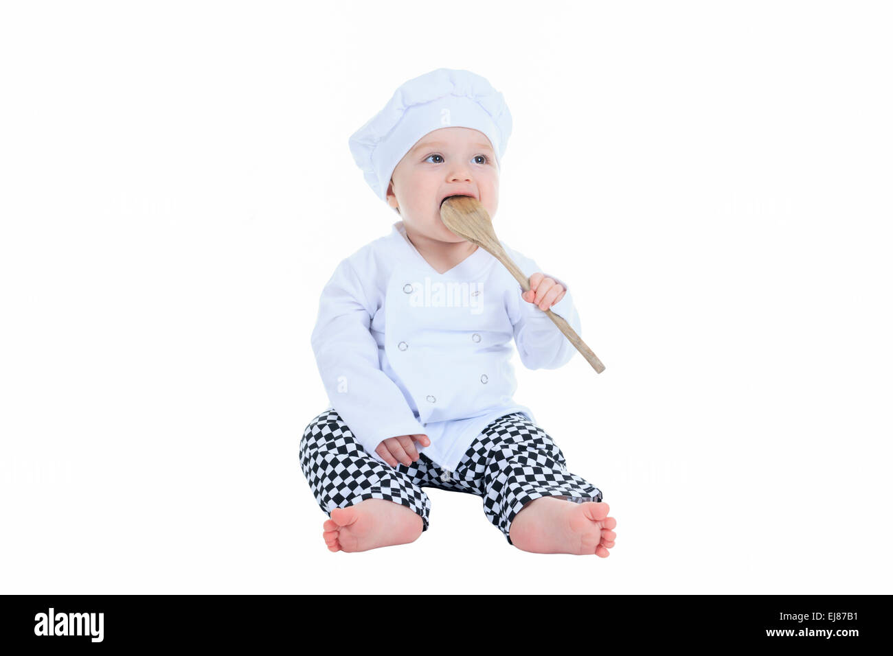 Cute little cook boy in front of a white background Stock Photo