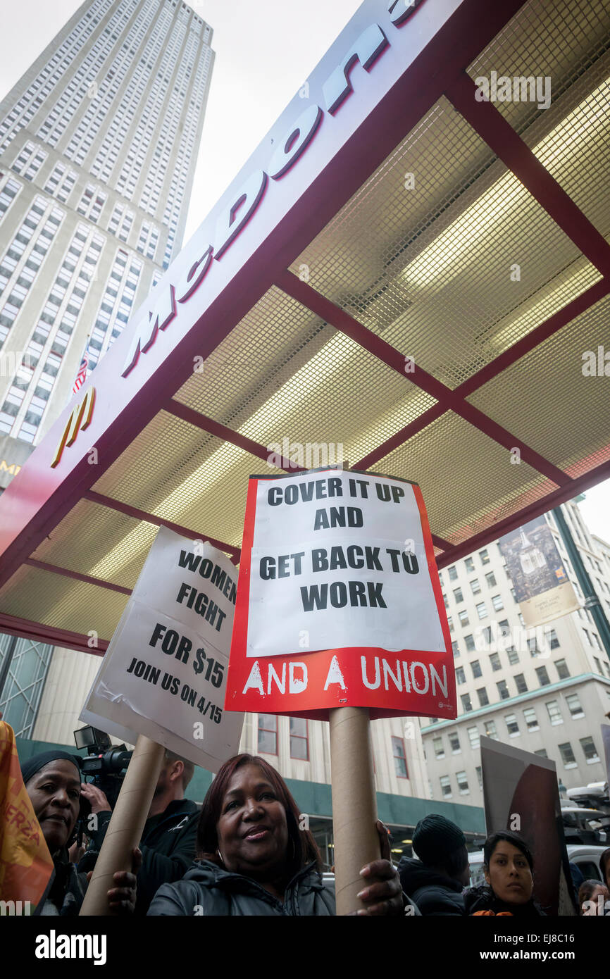 Workers at fast food restaurants and their supporters protest in front of a McDonald's restaurant in New York on Tuesday, March 17, 2015. Fast food workers have filed 28 OSHA complaints in 19 cities against the fast food chain. The workers allege that understaffing and the pressure to work fast creates hazardous working conditions leading to burns, cuts and other injuries.  (© Richard B. Levine) Stock Photo