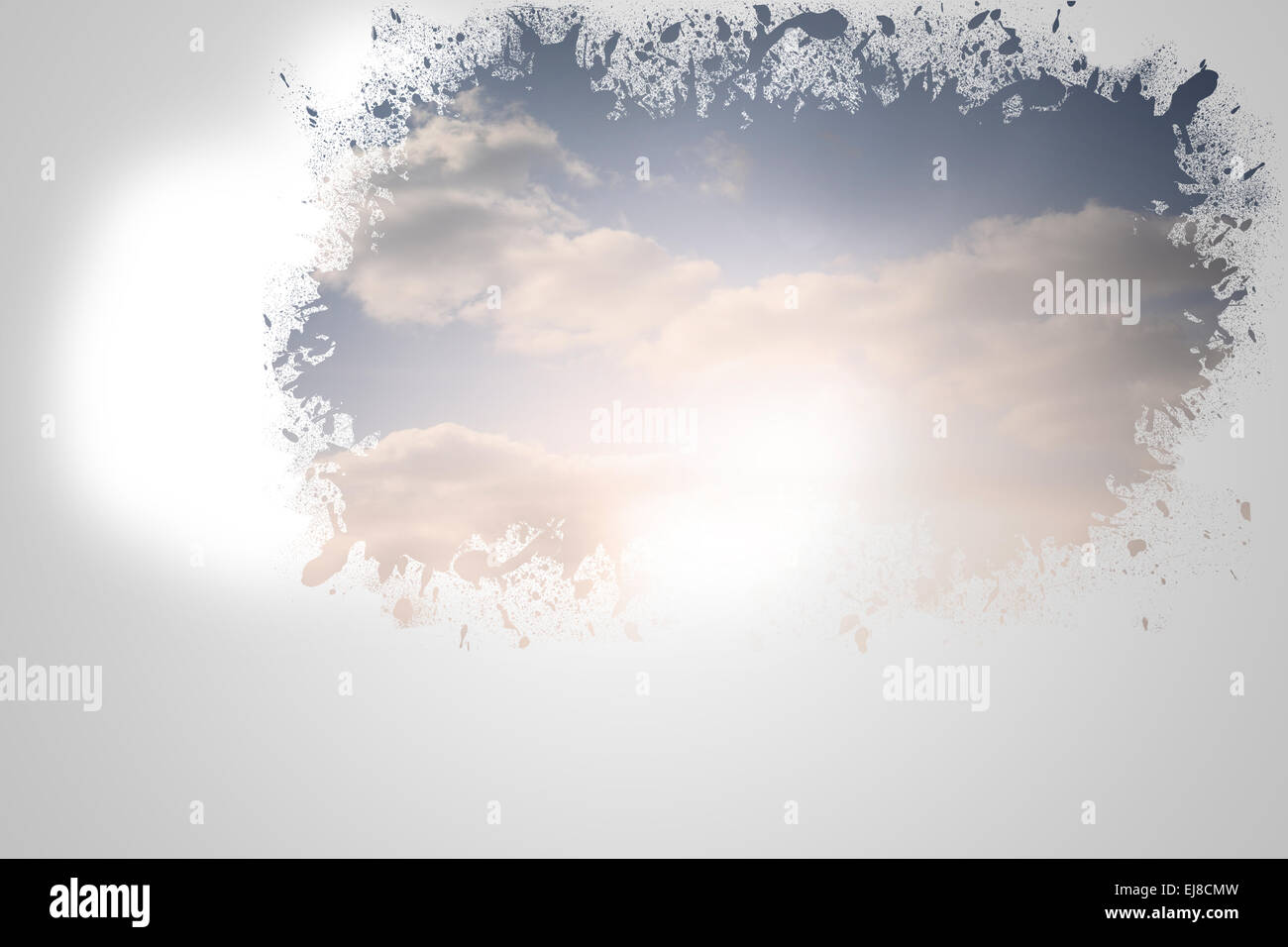 Splash on wall revealing bright sky Stock Photo