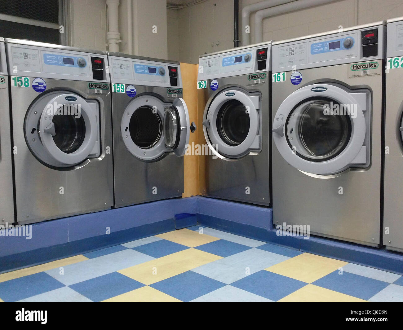 Empty washing machines in a laundry room in New York on Tuesday,  March 10, 2015. (© Richard B. Levine) Stock Photo