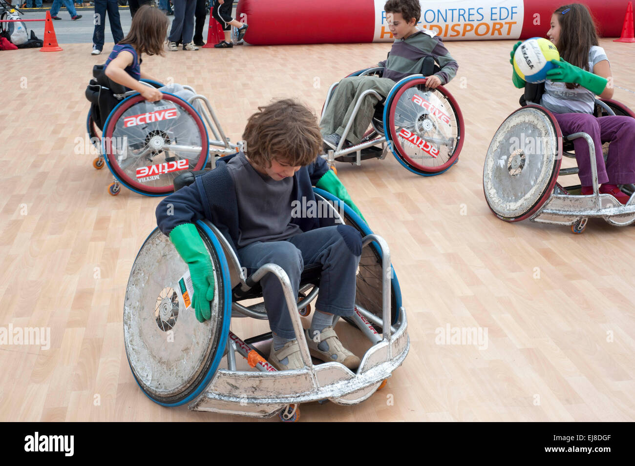 Paris, FRANCE -  French Handicapped Children in Wheelchair Basketball Game at  'Rencontres EDF Handisport'. special needs exercise, teaching sport to kids Stock Photo