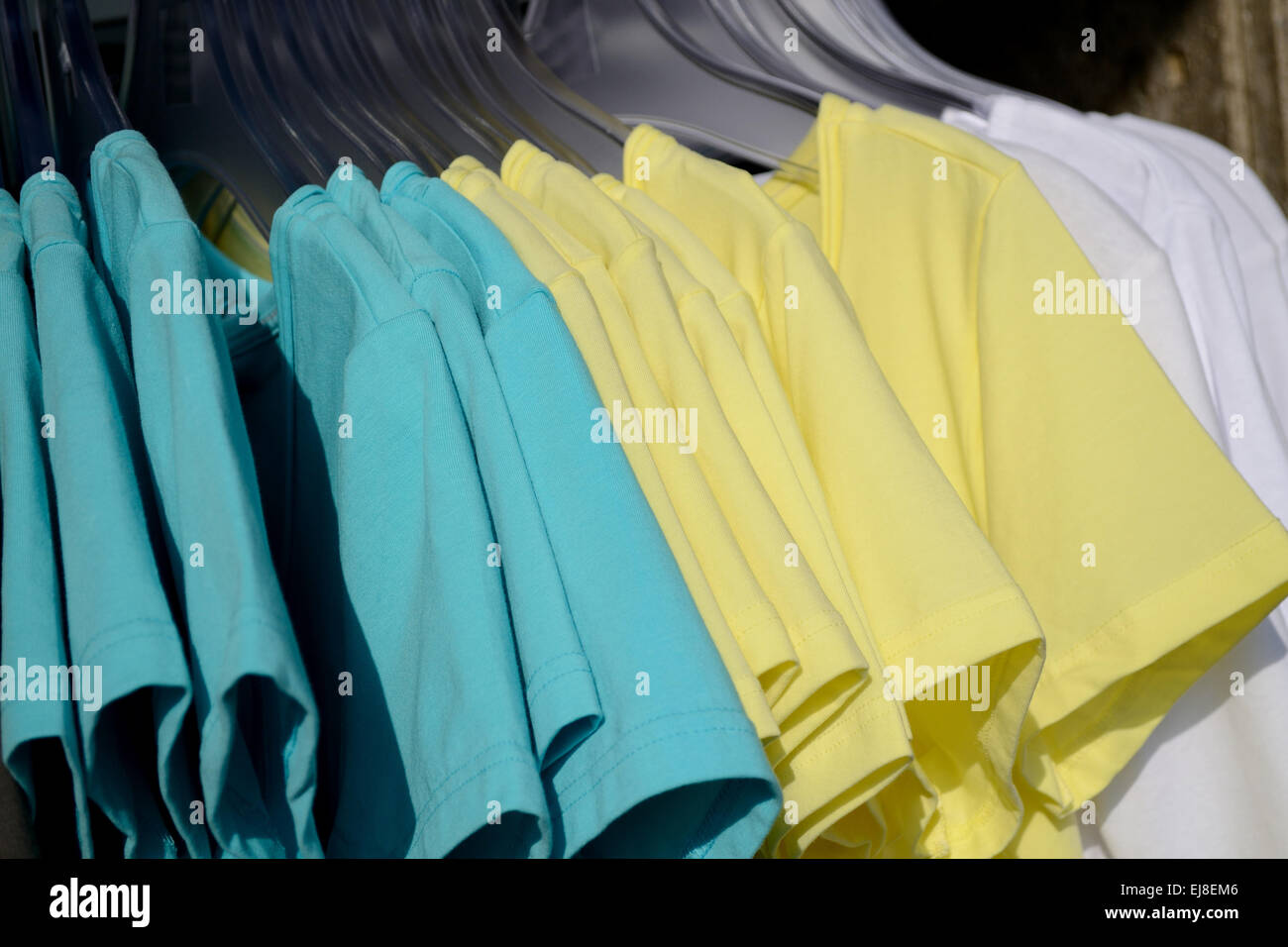 different colored T-shirts to choose from Stock Photo