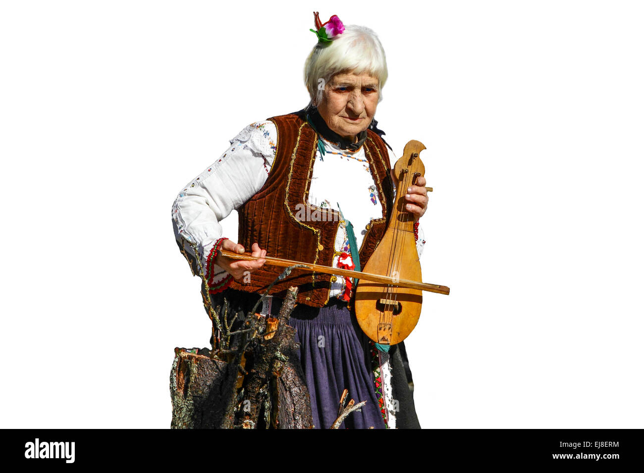 Old folk lady playing the fiddle Stock Photo