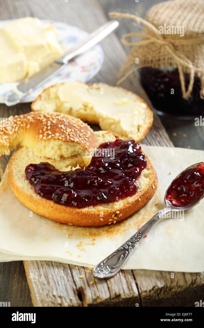 Bagel with jam and butter. Stock Photo