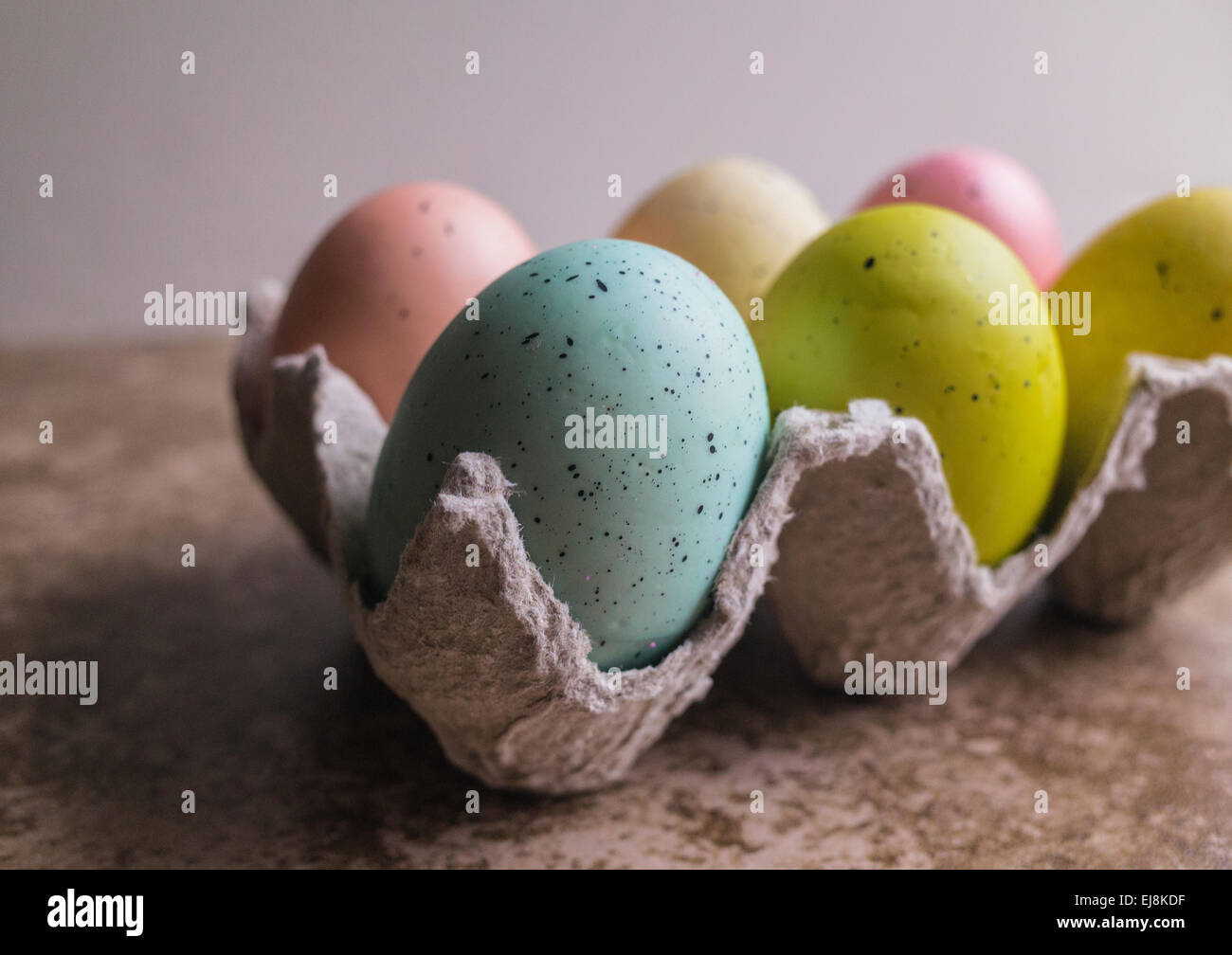 Six pastel colored Easter eggs in egg carton Stock Photo - Alamy