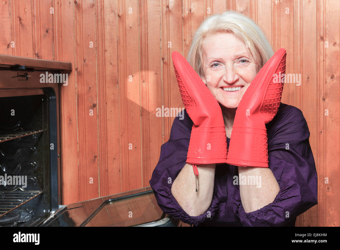 senior woman baking cookies on the stove Stock Photo Alamy