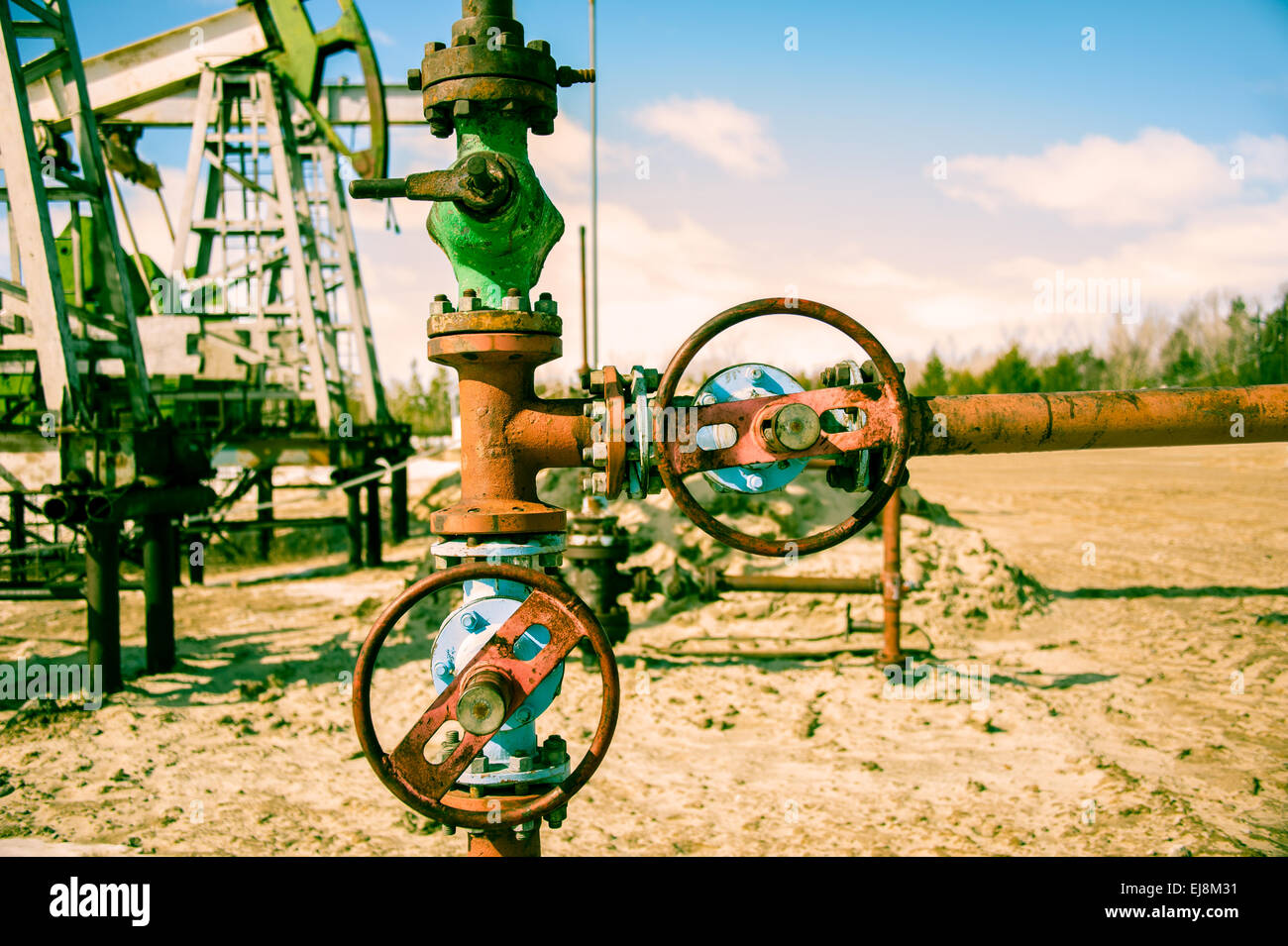 Wellhead and pump jack Stock Photo Alamy