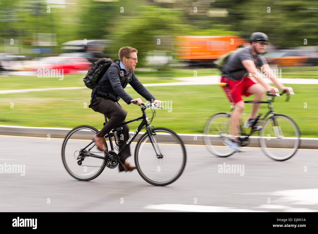 Man commuting to work on bicycle Stock Photo