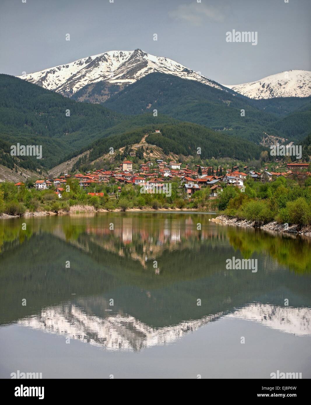 Mountain village reflection in the lake Stock Photo